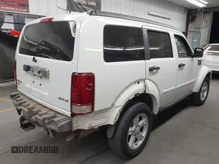 2007 Dodge Nitro SLT with VIN 1D8GU58K97W583408, listed as a IAAI auction lot 41653696 with 124,449 mi miles. Bid and sale history available at carsss.com. Image 4.