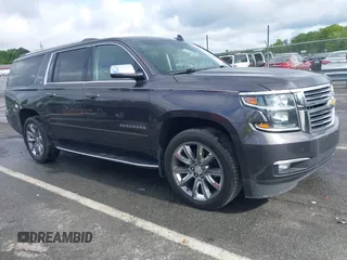 2015 Chevrolet Suburban LTZ with VIN 1GNSKKKC4FR589913, listed as a IAAI auction lot 42017190 with 216,145 mi miles. Bid and sale history available at carsss.com. Image 1.