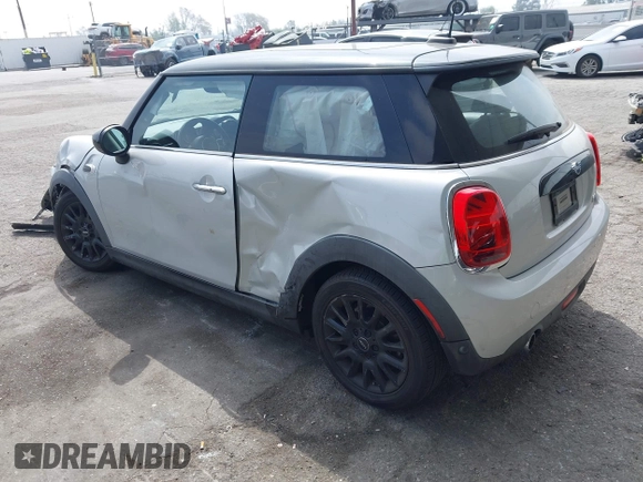2021 MINI Hardtop Cooper with VIN WMWXR3C09M2N96671, listed as a IAAI auction lot 42031023 with 12,450 mi miles and . Bid and sale history available at DreamBid. Image 3.