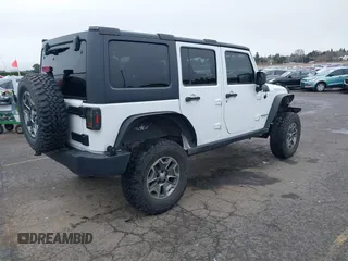 2014 Jeep Wrangler Unlimited Rubicon with VIN 1C4BJWFGXEL283929, listed as a IAAI auction lot 41812052 with 137,790 mi miles and . Bid and sale history available at DreamBid. Image 4.