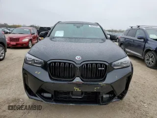 2022 BMW X4 M z VIN 5YM23EC00N9M68670, wystawiony jako Copart lot #80404663 z przebiegiem 5979 mil mil oraz . Historia ofert i sprzedaży dostępna na DreamBid. Obrazek 5.