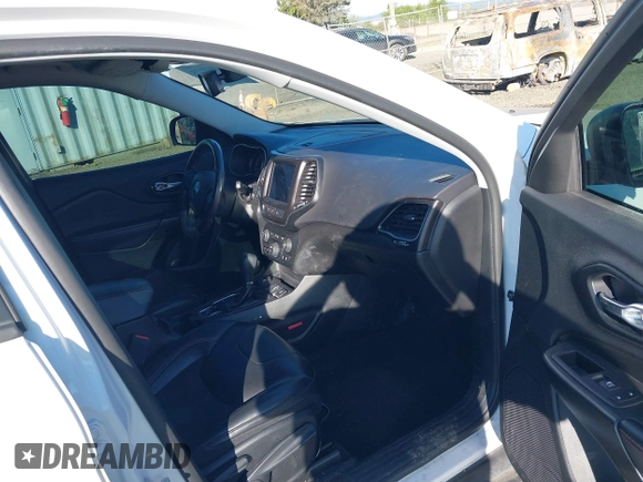 2021 Jeep Cherokee Trailhawk with VIN 1C4PJMBX9MD105888, listed as a IAAI auction lot 42065175 with 55,469 mi miles and . Bid and sale history available at DreamBid. Image 5.