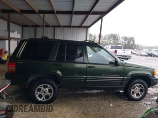 1997 Jeep Grand Cherokee Limited with VIN 1J4GZ78Y5VC723429, listed as a IAAI auction lot 42012836 with 231,126 mi miles. Bid and sale history available at carsss.com. Image 13.