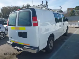 2014 Chevrolet Express Cargo Van with VIN 1GCWGFCB2E1122236, listed as a IAAI auction lot 41381131 with 70,696 mi miles. Bid and sale history available at carsss.com. Image 4.