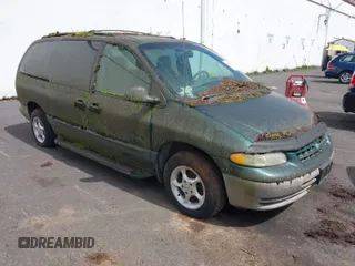 1999 Plymouth Voyager Grand SE z VIN 1P4GP44G0XB579719, wystawiony jako IAAI lot #41981925 z przebiegiem 163 940 mil mil oraz . Historia ofert i sprzedaży dostępna na DreamBid. Obrazek 1.