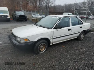 1989 Toyota Corolla with VIN JT2AE92E0K3221515, listed as a Copart auction lot 83002584 with 67,475 mi miles and Salvage title. Bid and sale history available at DreamBid. Image 1.