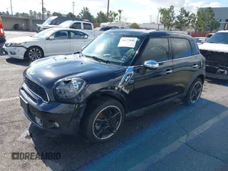 2014 MINI Countryman S with VIN WMWZC3C56EWP27880, listed as a IAAI auction lot 38577048 with 96,812 mi miles and . Bid and sale history available at DreamBid. Image 2.