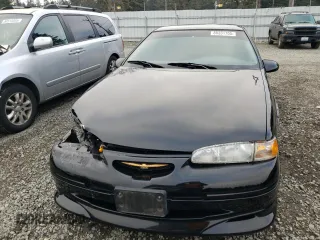 1997 Ford Thunderbird LX with VIN 1FALP62W1VH110468, listed as a Copart auction lot 88331705 with 84,349 mi miles and Salvage Title. Bid and sale history available at DreamBid. Image 5.