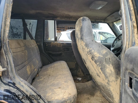 2000 Jeep Cherokee with VIN 1J4FF48S7YL209729, listed as a Copart auction lot 53647685 with 268,552 mi miles and Salvage title. Bid and sale history available at DreamBid. Image 10.