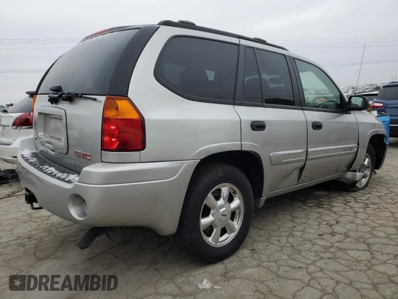 2005 GMC Envoy SLT with VIN 1GKDS13S452258553, listed as a Copart auction lot 82888944 with 174,546 mi miles and Salvage title. Bid and sale history available at DreamBid. Image 3.