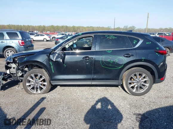 2019 Mazda CX-5 Grand Touring with VIN JM3KFBDM7K0525650, listed as a IAAI auction lot 42032757 with 65,530 mi miles and . Bid and sale history available at DreamBid. Image 15.