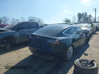 2020 Tesla Model 3 Standard Range Plus with VIN 5YJ3E1EA0LF660759, listed as a IAAI auction lot 41505250 with 63,322 mi miles and . Bid and sale history available at DreamBid. Image 4.