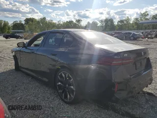 2024 BMW i5 eDrive40 with VIN WBY33FK04RCR49355, listed as a Copart auction lot 55828475 with Not Provided miles and Salvage Title. Bid and sale history available at DreamBid. Image 2.