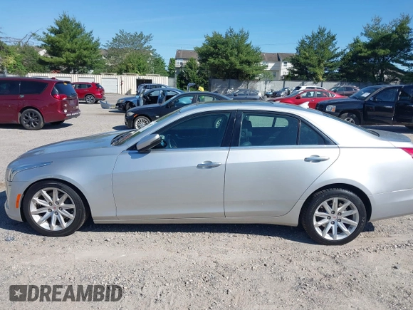 2014 Cadillac CTS Luxury AWD with VIN 1G6AX5S34E0124464, listed as a IAAI auction lot 42298607 with 89,351 mi miles and . Bid and sale history available at DreamBid. Image 14.