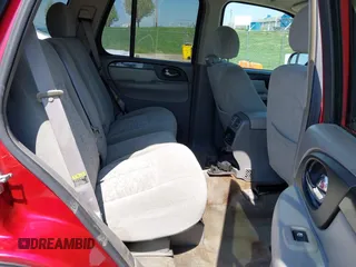 2005 GMC Envoy SLT with VIN 1GKDS13SX52144959, listed as a IAAI auction lot 41968495 with 238,199 mi miles. Bid and sale history available at carsss.com. Image 8.