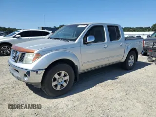 2005 Nissan Frontier LE z VIN 1N6AD07W95C443995, wystawiony jako Copart lot #61102285 z przebiegiem 248 740 mil mil oraz Czysty tytuł • Clean title. Historia ofert i sprzedaży dostępna na DreamBid. Obrazek 1.