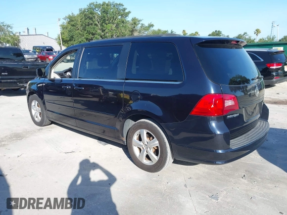 2011 Volkswagen Routan SE with VIN 2V4RW3DG5BR668194, listed as a IAAI auction lot 42483379 with 203,945 mi miles and . Bid and sale history available at DreamBid. Image 3.