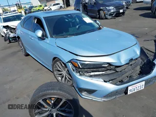 2023 Honda Civic Touring z VIN 2HGFE1F93PH310156, wystawiony jako IAAI lot #41946949 z przebiegiem 26 753 mil mil oraz . Historia ofert i sprzedaży dostępna na DreamBid. Obrazek 1.