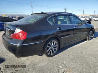 2009 Infiniti M with VIN JNKCY01E69M801908, listed as a Copart auction lot 88207735 with 90,163 mi miles and Salvage Title. Bid and sale history available at DreamBid. Image 3.