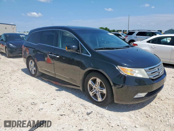 2011 Honda Odyssey Touring with VIN 5FNRL5H90BB033700, listed as a Copart auction lot 58602835 with 197,063 mi miles and Clean title. Bid and sale history available at DreamBid. Image 4.