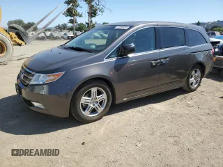2012 Honda Odyssey Touring с VIN 5FNRL5H9XCB116455, выставлен на аукционе Copart как лот 60880835 с пробегом 96 672 миль миль и Списание • Salvage title. История ставок и продаж доступна на DreamBid. Изображение 1.