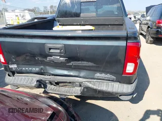 2018 Chevrolet Silverado 1500 High Country with VIN 3GCUKTEC8JG308353, listed as a IAAI auction lot 40714183 with 88,711 mi miles and . Bid and sale history available at DreamBid. Image 16.