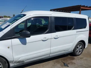 2014 Ford Transit Connect XLT z VIN NM0GE9F73E1142883, wystawiony jako IAAI lot #42574581 z przebiegiem 180 512 mil mil oraz . Historia ofert i sprzedaży dostępna na DreamBid. Obrazek 14.