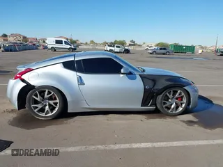 2014 Nissan 370Z Nismo with VIN JN1AZ4EHXEM634418, listed as a IAAI auction lot 41308580 with 84,074 mi miles and . Bid and sale history available at DreamBid. Image 13.