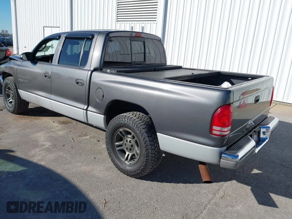 2001 Dodge Dakota Sport with VIN 1B7HL2AN21S319390, listed as a IAAI auction lot 40836729 with 118,823 mi miles. Bid and sale history available at carsss.com. Image 3.