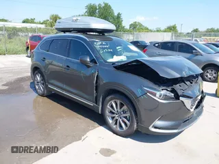2022 Mazda CX-9 Grand Touring with VIN JM3TCBDY4N0618680, listed as a IAAI auction lot 40086806 with 34,142 mi miles and . Bid and sale history available at carsss.com. Image 1.