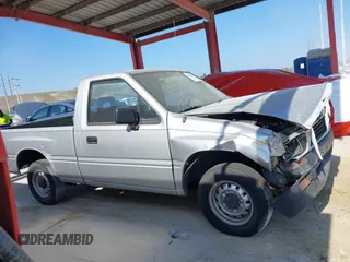 1990 Isuzu Pickup S z VIN JAACL11L6L7206171, wystawiony jako IAAI lot #42214364 z przebiegiem 75 057 mil mil oraz . Historia ofert i sprzedaży dostępna na DreamBid. Obrazek 13.
