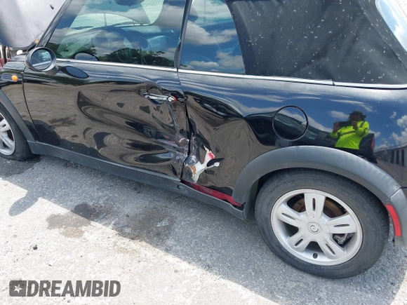 2006 MINI Convertible with VIN WMWRF33566TG15464, listed as a IAAI auction lot 42285777 with 144,430 mi miles and . Bid and sale history available at DreamBid. Image 6.