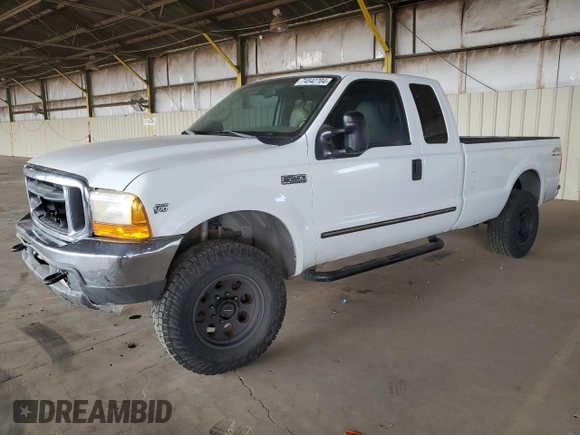 2000 Ford Super Duty F-250 XL with VIN 1FTNX21S9YED03242, listed as a Copart auction lot 74542704 with 218,739 mi miles and Salvage Title. Bid and sale history available at carsss.com. Image 1.