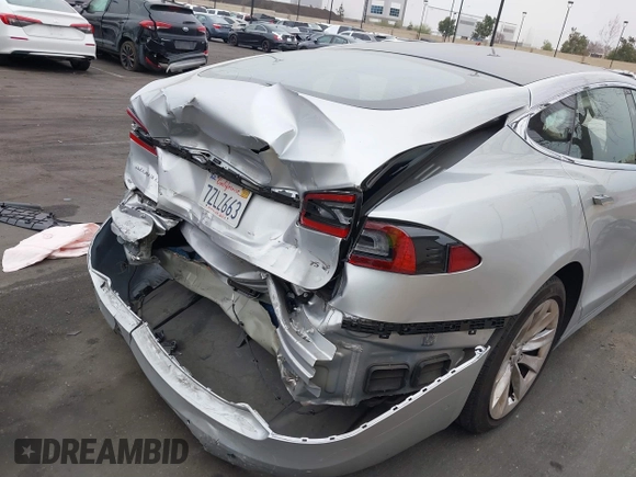 2017 Tesla Model S 60 with VIN 5YJSA1E17HF189627, listed as a IAAI auction lot 41891766 with 106,003 mi miles and . Bid and sale history available at DreamBid. Image 20.