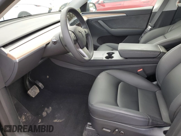 2024 Tesla Model Y with VIN 7SAYGDED1RA321691, listed as a Copart auction lot 52153945 with 7,544 mi miles and Salvage Title. Bid and sale history available at DreamBid. Image 7.