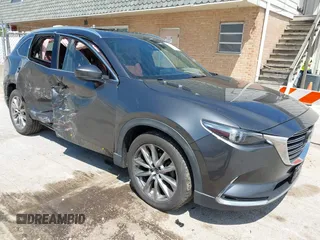 2016 Mazda CX-9 Signature with VIN JM3TCBEY2G0124433, listed as a IAAI auction lot 42194154 with 108,945 mi miles and . Bid and sale history available at DreamBid. Image 1.