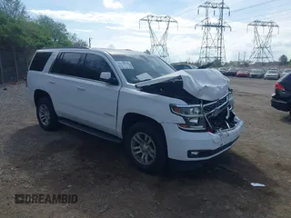 2019 Chevrolet Tahoe LT z VIN 1GNSKBKC4KR391312, wystawiony jako IAAI lot #42128582 z przebiegiem 64 543 mil mil oraz . Historia ofert i sprzedaży dostępna na DreamBid. Obrazek 1.
