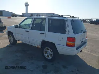 1997 Jeep Grand Cherokee Limited with VIN 1J4GZ78Y8VC769675, listed as a IAAI auction lot 41694347 with 113,834 mi miles. Bid and sale history available at carsss.com. Image 3.