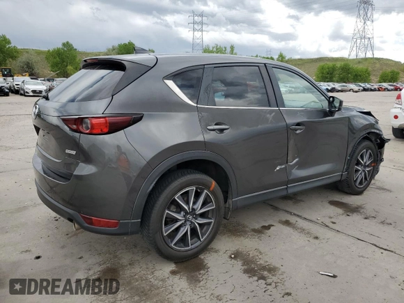 2018 Mazda CX-5 Touring z VIN JM3KFBCM4J0349687, wystawiony jako Copart lot #55857945 z przebiegiem Nie podano mil oraz Szkoda całkowita • Salvage title. Historia ofert i sprzedaży dostępna na DreamBid. Obrazek 3.