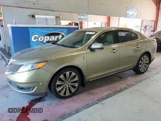 2013 Lincoln MKS EcoBoost with VIN 1LNHL9FT2DG604657, listed as a Copart auction lot 65357735 with 133,548 mi miles and Salvage title. Bid and sale history available at DreamBid. Image 1.
