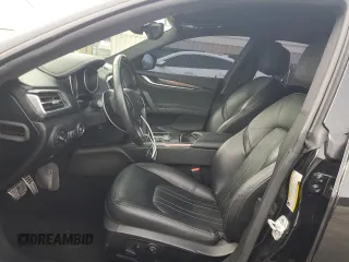2019 Maserati Ghibli с VIN ZAM57XSA3K1311169, выставлен на аукционе Copart как лот 49583325 с пробегом 66 290 миль миль и Списание • Salvage title. История ставок и продаж доступна на DreamBid. Изображение 7.