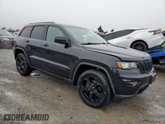 2018 Jeep Grand Cherokee Laredo E with VIN 1C4RJFAG0JC394456, listed as a Copart auction lot 50465325 with 114,095 mi miles and Salvage Title. Bid and sale history available at DreamBid. Image 4.