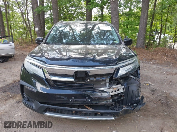 2019 Honda Pilot Touring 7-Passenger with VIN 5FNYF6H60KB030990, listed as a IAAI auction lot 42160762 with 68,807 mi miles and . Bid and sale history available at DreamBid. Image 12.