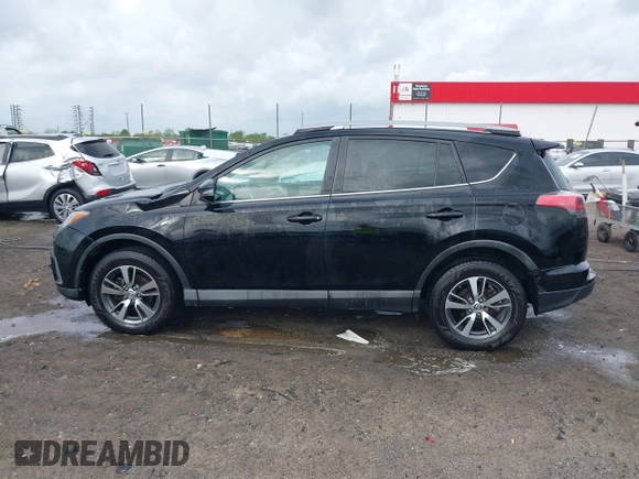 2018 Toyota RAV4 XLE with VIN 2T3WFREV9JW412755, listed as a IAAI auction lot 41889960 with 216,451 mi miles and . Bid and sale history available at carsss.com. Image 14.
