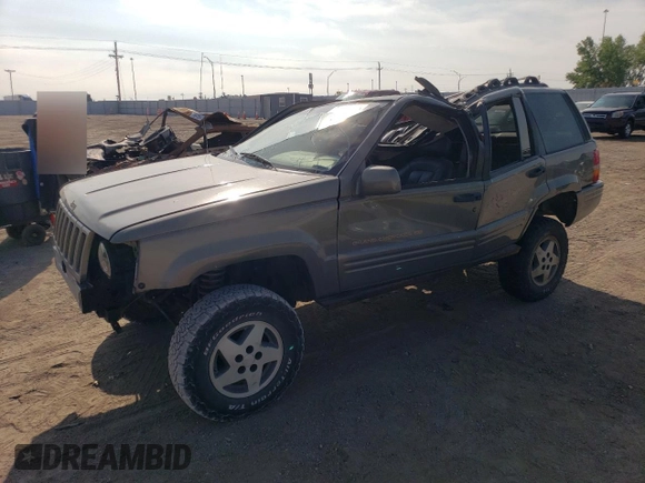 1998 Jeep Grand Cherokee Limited with VIN 1J4GZ78Y2WC146974, listed as a Copart auction lot 71435484 with 192,996 mi miles and Salvage Title. Bid and sale history available at carsss.com. Image 1.