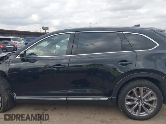 2023 Mazda CX-9 Grand Touring with VIN JM3TCBDY2P0632239, listed as a IAAI auction lot 41543302 with 56,603 mi miles and . Bid and sale history available at carsss.com. Image 15.