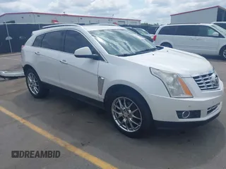 2014 Cadillac SRX Performance Collection z VIN 3GYFNCE38ES588398, wystawiony jako IAAI lot #42115787 z przebiegiem 159 702 mil mil oraz . Historia ofert i sprzedaży dostępna na DreamBid. Obrazek 1.