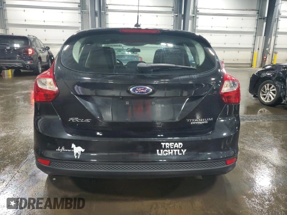 2014 Ford Focus Titanium with VIN 1FADP3N2XEL131392, listed as a Copart auction lot 61665025 with 105,597 mi miles and Salvage title. Bid and sale history available at DreamBid. Image 6.