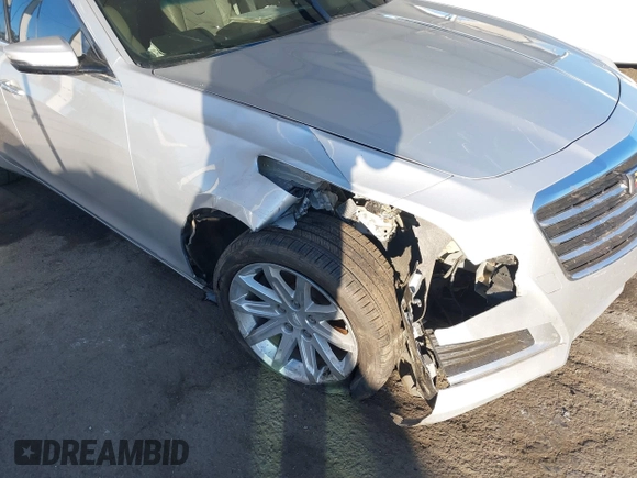 2015 Cadillac CTS AWD z VIN 1G6AW5SX2F0104981, wystawiony jako IAAI lot #41276740 z przebiegiem 87 128 mil mil oraz . Historia ofert i sprzedaży dostępna na DreamBid. Obrazek 6.