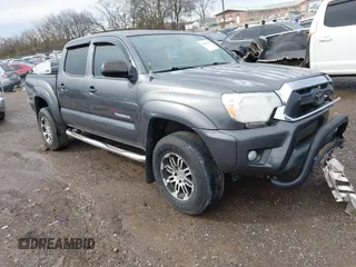 2014 Toyota Tacoma with VIN 3TMLU4EN5EM142605, listed as a IAAI auction lot 41463795 with 99,455 mi miles. Bid and sale history available at carsss.com. Image 1.